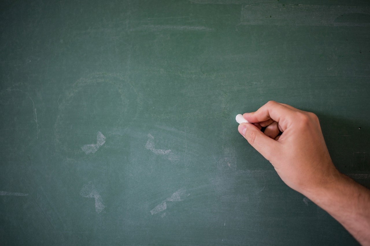 Why do fingernails (and sometimes chalk) sound so awful on a blackboard?